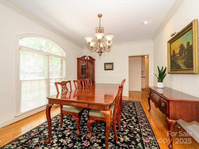 1209 S S St, Gastonia, NC 28052 - dining room featuring crown molding, a chandelier, and light wood-type flooring