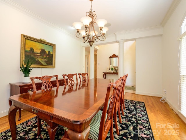 1209 S S St, Gastonia, NC 28052 - dining space featuring ornamental molding, light wood finished floors, a chandelier, and baseboards