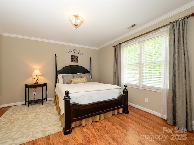 1209 S S St, Gastonia, NC 28052 - bedroom with light wood finished floors, baseboards, and ornamental molding