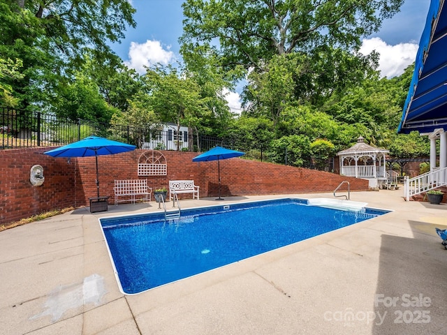1209 S S St, Gastonia, NC 28052 - view of swimming pool with a gazebo, a patio, and view of scattered trees