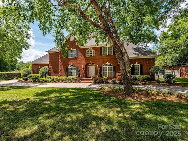 1209 S S St, Gastonia, NC 28052 - view of front facade featuring brick siding and a front yard