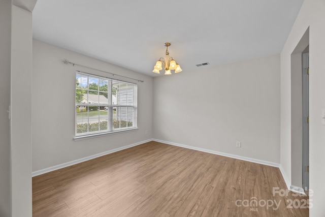 423 Courtland Ct, Kannapolis, NC 28081 - empty room with a chandelier, wood finished floors, and baseboards