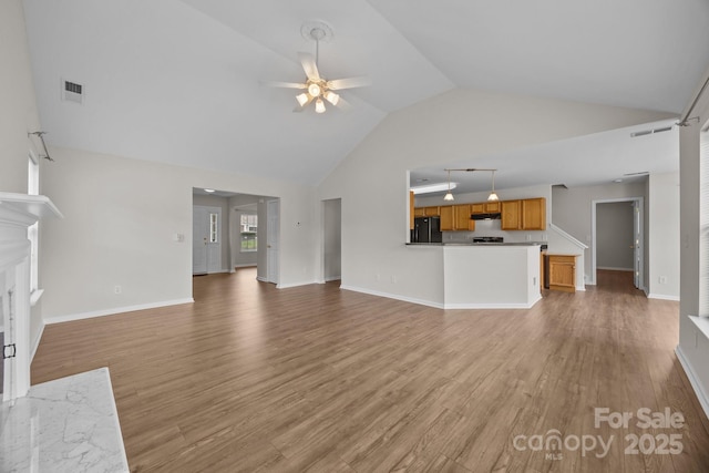 423 Courtland Ct, Kannapolis, NC 28081 - unfurnished living room featuring ceiling fan, light wood finished floors, high vaulted ceiling, baseboards, and a fireplace with flush hearth