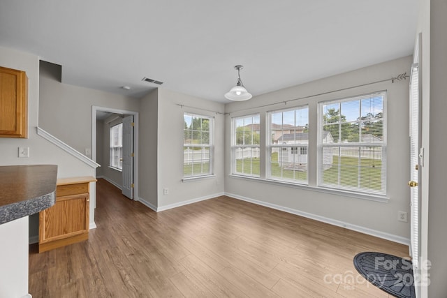 423 Courtland Ct, Kannapolis, NC 28081 - unfurnished dining area with plenty of natural light, wood finished floors, and baseboards