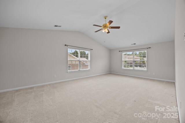 423 Courtland Ct, Kannapolis, NC 28081 - unfurnished room with lofted ceiling, a ceiling fan, carpet floors, and baseboards