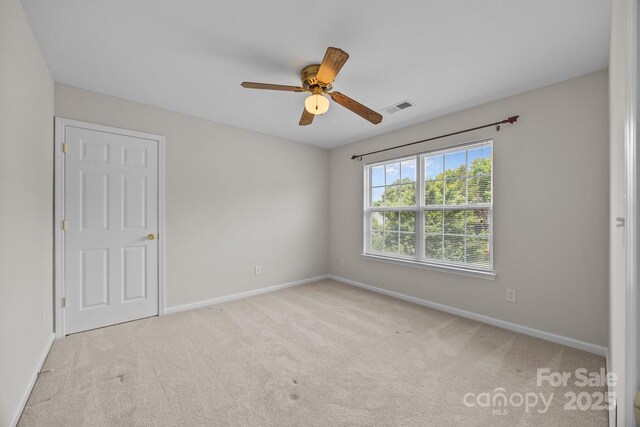 423 Courtland Ct, Kannapolis, NC 28081 - unfurnished bedroom featuring baseboards, carpet flooring, and ceiling fan