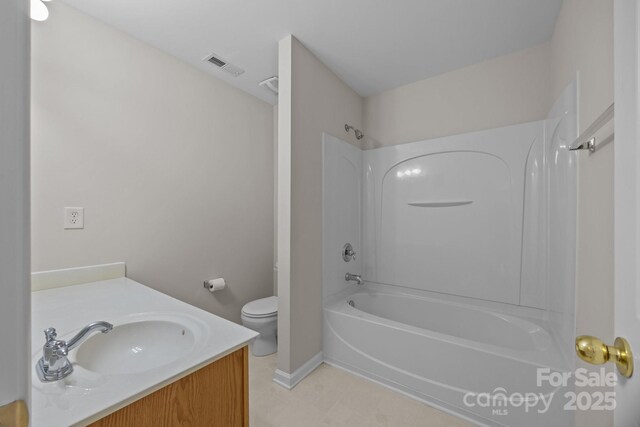423 Courtland Ct, Kannapolis, NC 28081 - bathroom featuring toilet, shower / bath combination, vanity, and baseboards
