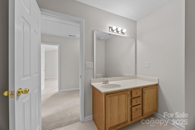 423 Courtland Ct, Kannapolis, NC 28081 - bathroom with vanity, baseboards, and toilet