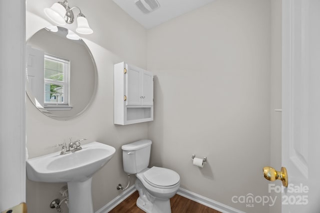 423 Courtland Ct, Kannapolis, NC 28081 - bathroom featuring wood finished floors, toilet, and baseboards