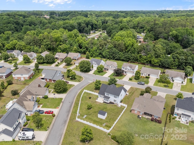 423 Courtland Ct, Kannapolis, NC 28081 - aerial perspective of suburban area with a forest