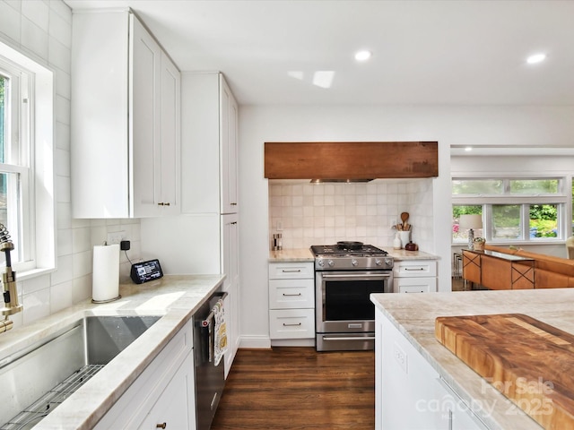 1638 Wensley Dr, Charlotte, NC 28210 - kitchen with appliances with stainless steel finishes, backsplash, light stone countertops, white cabinetry, and recessed lighting