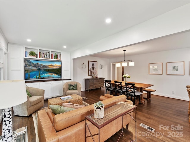 1638 Wensley Dr, Charlotte, NC 28210 - living area with dark wood-style flooring, recessed lighting, and baseboards