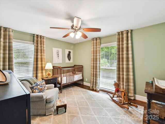 1638 Wensley Dr, Charlotte, NC 28210 - bedroom featuring baseboards, wood finished floors, and ceiling fan
