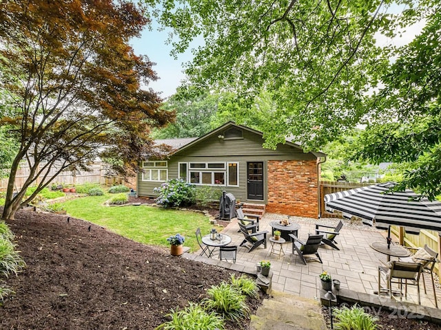 1638 Wensley Dr, Charlotte, NC 28210 - rear view of house featuring brick siding and a patio area