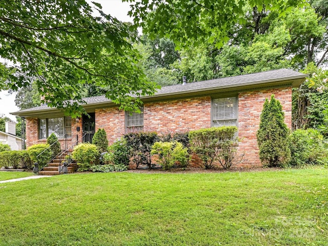 1638 Wensley Dr, Charlotte, NC 28210 - ranch-style house featuring a front yard, brick siding, and a shingled roof