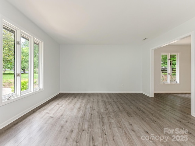 406 Wilcrest Dr, Matthews, NC 28105 - spare room featuring plenty of natural light and wood finished floors