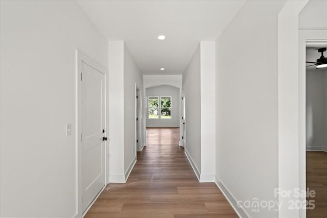 8632 Cedarbrook Dr, Charlotte, NC 28215 - hall featuring wood finished floors, recessed lighting, baseboards, and arched walkways