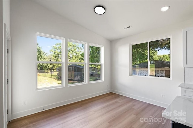 8632 Cedarbrook Dr, Charlotte, NC 28215 - interior space featuring light wood-style flooring, lofted ceiling, baseboards, and recessed lighting