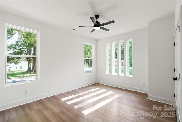 8632 Cedarbrook Dr, Charlotte, NC 28215 - spare room with wood finished floors, baseboards, and ceiling fan