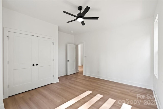 8632 Cedarbrook Dr, Charlotte, NC 28215 - unfurnished bedroom featuring baseboards, light wood-style floors, and a closet