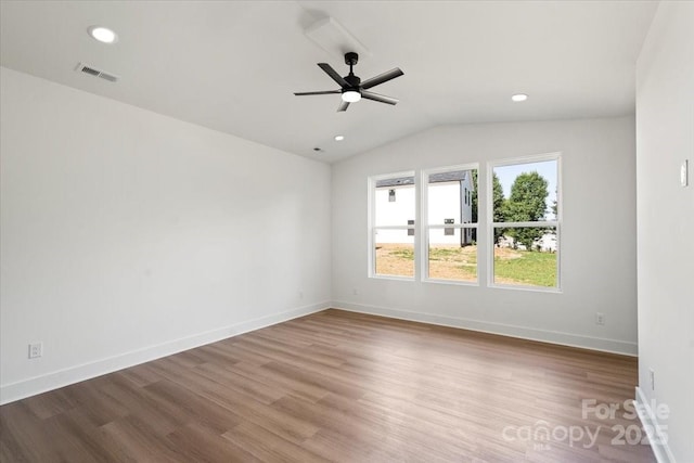 8632 Cedarbrook Dr, Charlotte, NC 28215 - unfurnished room with lofted ceiling, wood finished floors, ceiling fan, baseboards, and recessed lighting