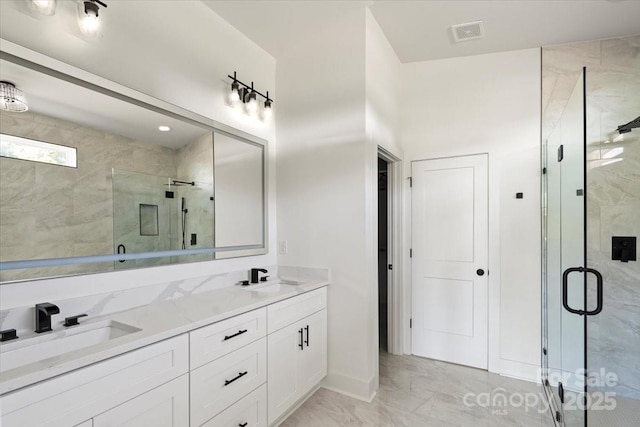 8632 Cedarbrook Dr, Charlotte, NC 28215 - bathroom with marble finish flooring, double vanity, and a shower stall