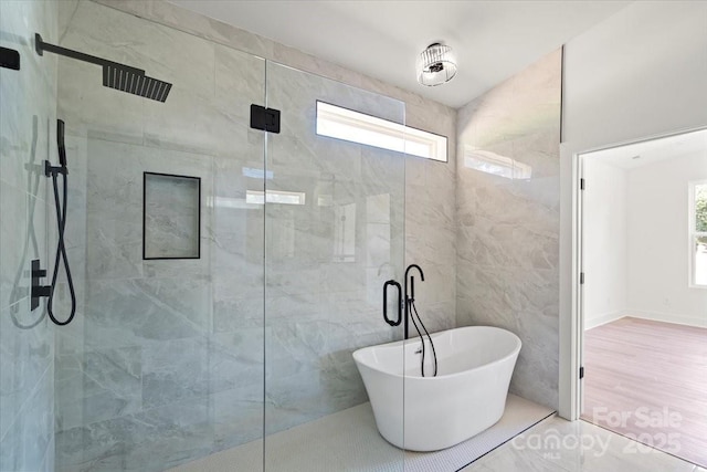 8632 Cedarbrook Dr, Charlotte, NC 28215 - full bath with healthy amount of natural light, a tile shower, a freestanding bath, and tile walls
