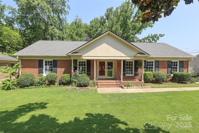 2443 Knickerbocker Dr, Charlotte, NC 28212 - ranch-style home with brick siding, a porch, and a front lawn