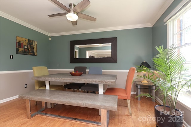 2443 Knickerbocker Dr, Charlotte, NC 28212 - dining space with wood finished floors, a ceiling fan, and crown molding