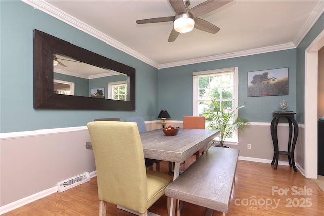 2443 Knickerbocker Dr, Charlotte, NC 28212 - dining area with ceiling fan, wood finished floors, and crown molding
