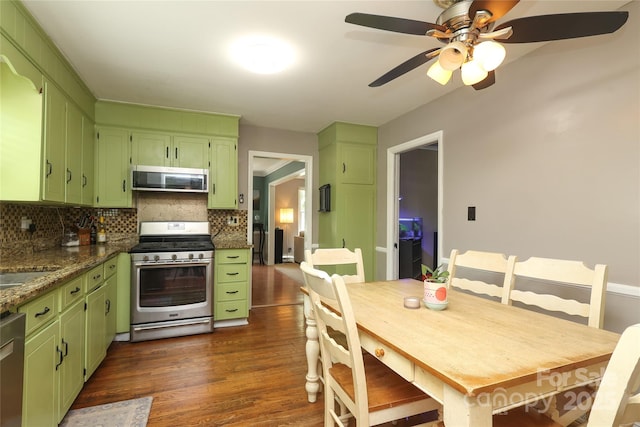 2443 Knickerbocker Dr, Charlotte, NC 28212 - kitchen with stainless steel appliances, green cabinetry, tasteful backsplash, and dark wood-type flooring