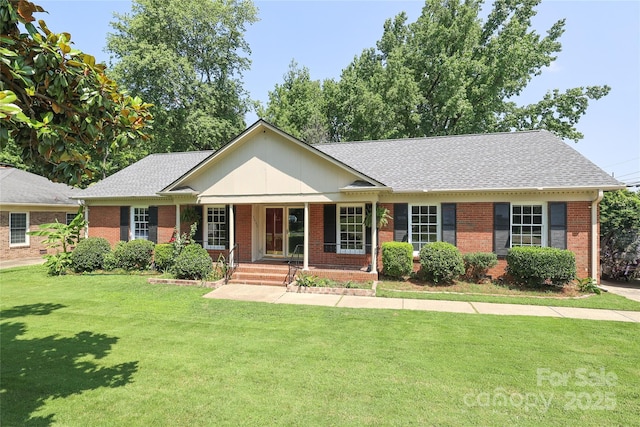 2443 Knickerbocker Dr, Charlotte, NC 28212 - single story home with brick siding, a porch, a front lawn, and a shingled roof