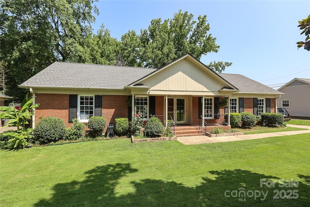 2443 Knickerbocker Dr, Charlotte, NC 28212 - ranch-style home with brick siding, covered porch, a front lawn, and roof with shingles