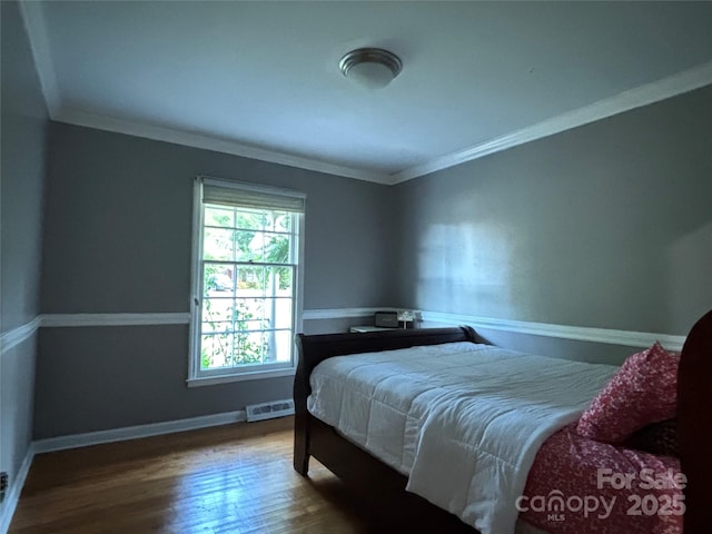 2443 Knickerbocker Dr, Charlotte, NC 28212 - bedroom featuring crown molding and wood finished floors