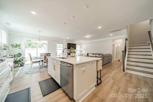 113 Summerhill Dr, Mooresville, NC 28115 - kitchen featuring dishwasher, ornamental molding, white cabinets, a sink, and an island with sink