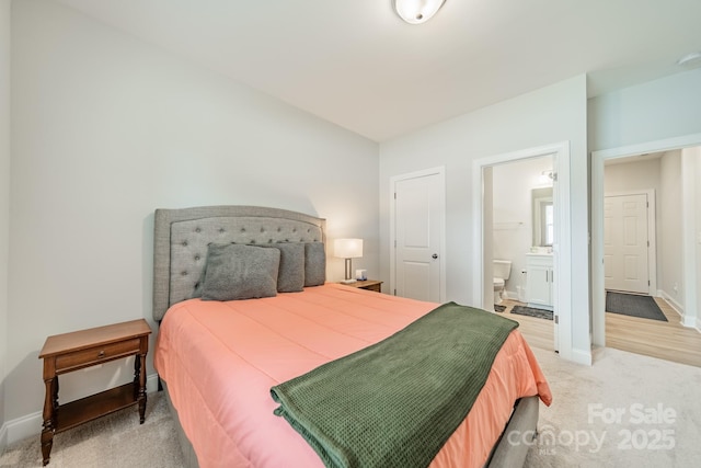 113 Summerhill Dr, Mooresville, NC 28115 - bedroom featuring light colored carpet, baseboards, and ensuite bath