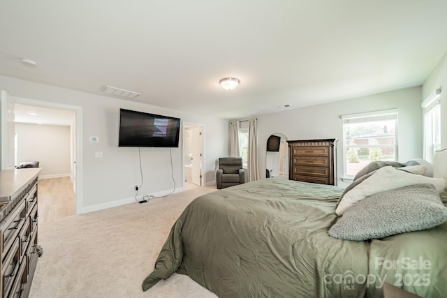 113 Summerhill Dr, Mooresville, NC 28115 - bedroom featuring light colored carpet, baseboards, and connected bathroom