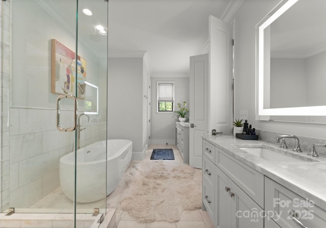 1160 S Kings Dr, Charlotte, NC 28207 - full bath featuring ornamental molding, vanity, a freestanding bath, a shower stall, and tile patterned flooring