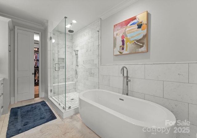 1160 S Kings Dr, Charlotte, NC 28207 - full bathroom with crown molding, a shower stall, a soaking tub, a spacious closet, and vanity
