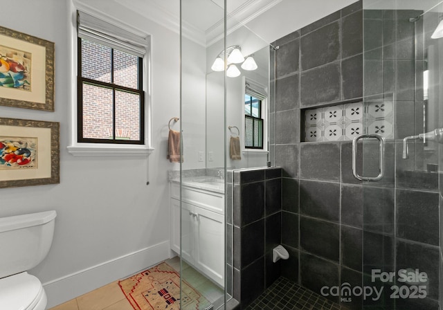 1160 S Kings Dr, Charlotte, NC 28207 - bathroom with ornamental molding, toilet, vanity, plenty of natural light, and a stall shower
