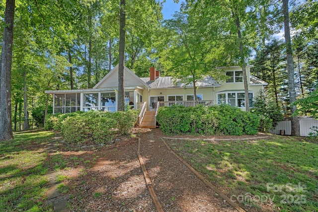 392 Stonemarker Rd, Mooresville, NC 28117 - view of front of home featuring a sunroom, a chimney, a wooden deck, and stairway