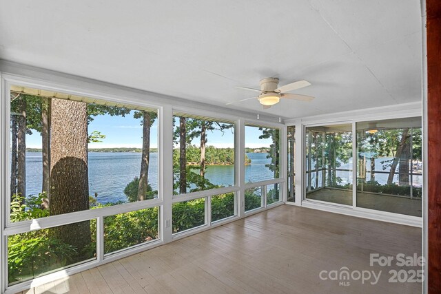 392 Stonemarker Rd, Mooresville, NC 28117 - unfurnished sunroom featuring a water view, plenty of natural light, and wood finished floors