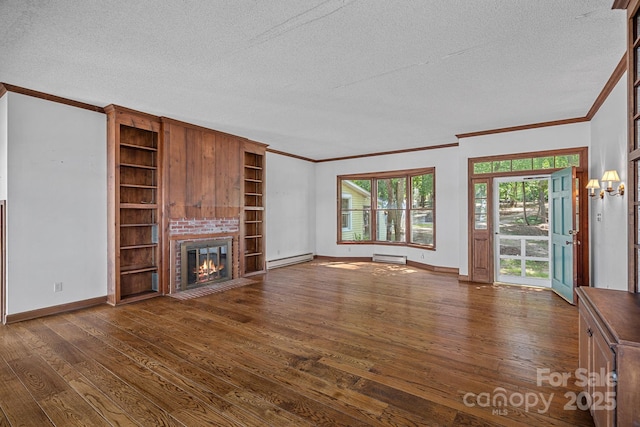 392 Stonemarker Rd, Mooresville, NC 28117 - unfurnished living room with ornamental molding, baseboard heating, dark wood-style flooring, a textured ceiling, and baseboards