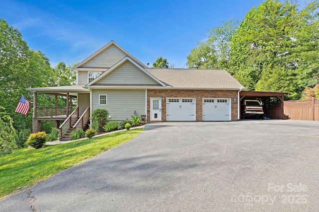 21 Hope Rd, Weaverville, NC 28787 - view of front facade with driveway, a garage, stairs, a porch, and roof with shingles