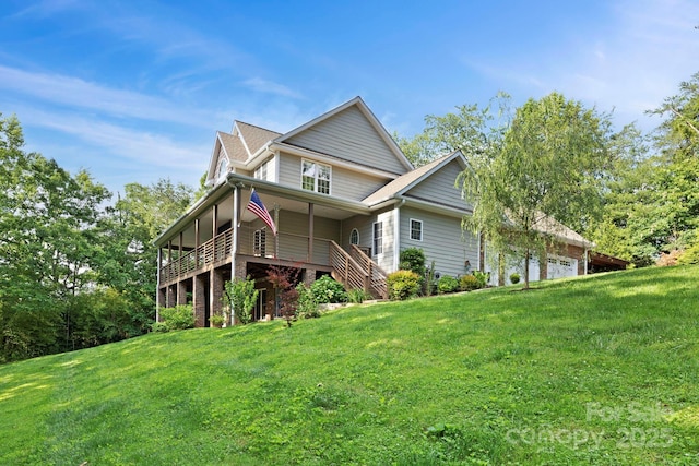 21 Hope Rd, Weaverville, NC 28787 - back of house with a lawn and an attached garage