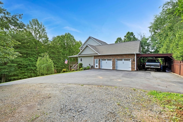 21 Hope Rd, Weaverville, NC 28787 - view of property exterior with driveway, a garage, and roof with shingles