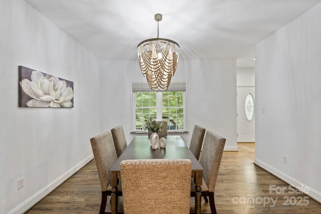 21 Hope Rd, Weaverville, NC 28787 - dining area with a chandelier, wood finished floors, and baseboards
