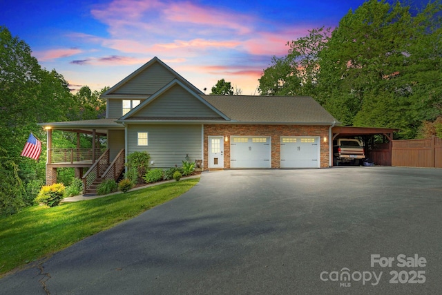 21 Hope Rd, Weaverville, NC 28787 - view of front of house featuring asphalt driveway, a garage, stairs, and covered porch