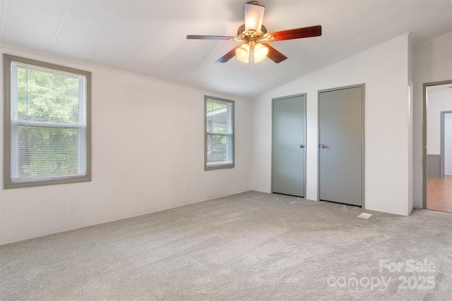 4648 Rifle Range Rd, Conover, NC 28613 - unfurnished bedroom with two closets, carpet flooring, lofted ceiling, and ceiling fan