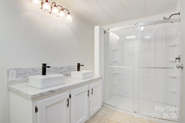 4648 Rifle Range Rd, Conover, NC 28613 - bathroom featuring a shower stall, double vanity, and backsplash